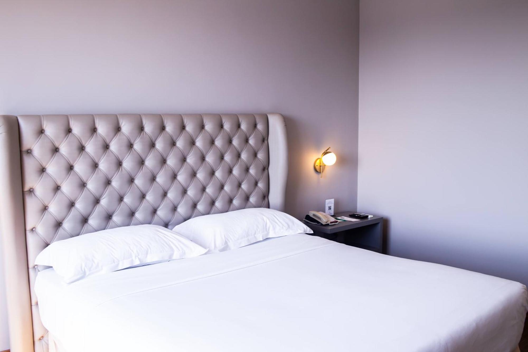 Ouro Minas Hotel Belo Horizonte, Dolce By Wyndham Bagian luar foto A bedroom at the hotel
